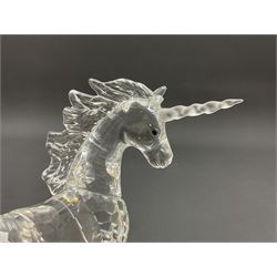 Swarovski Crystal animals, comprising white peacock, the tail with cascading blue flowers, perched eagle with yellow beak, ibex with frosted crystal horns and unicorn with frosted crystal horn, tallest H13cm