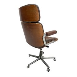 Mid-20th century Eames design desk chair, upholstered in brown leather, raised on chrome base with swivel action and castors