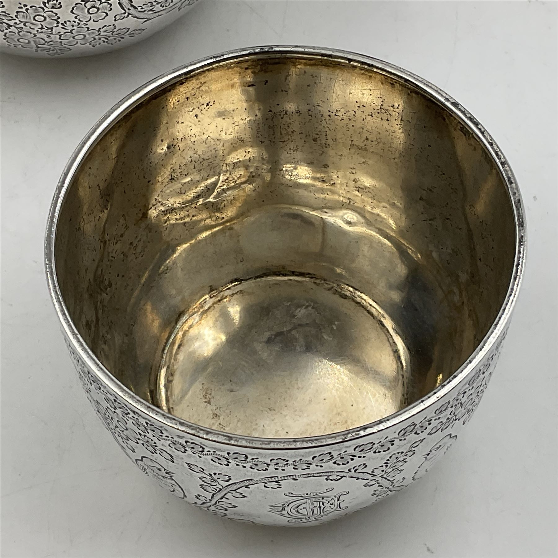 Late Victorian silver bachelors three piece tea service, comprising bullet shaped teapot, open sucrier and milk jug, each engraved with monogram surrounded by birds upon and amidst a blossoming vine, the teapot with scroll capped curved wooden handle and wooden finial to cover, hallmarked Wakely & Wheeler, London 1890, teapot including handle H12cm, sucrier H5.5cm 