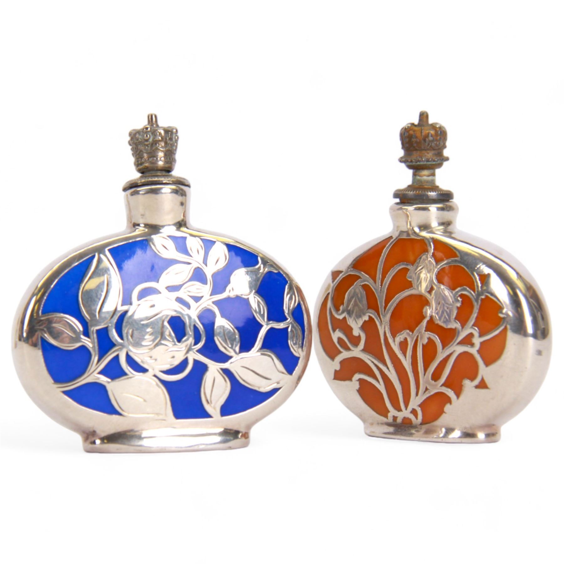 German silver and enamel perfume bottles, each with silver overlay floral decoration, and a crown top stopper, H6cm