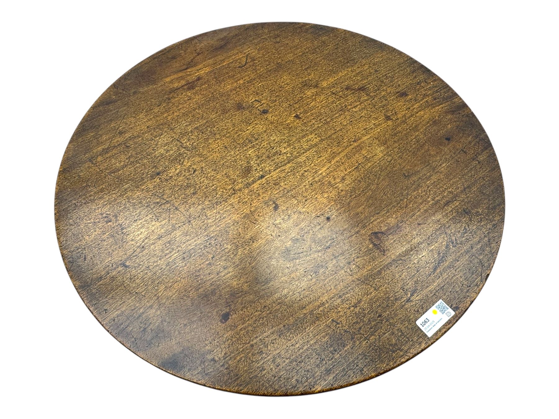 19th century mahogany tilt-top occasional table, circular top on a turned baluster column, raised on three splayed supports