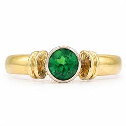 18ct gold tsavorite garnet ring, bezel set with a single round cut garnet, Birmingham 1992