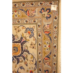  Large Persian Kashan ivory ground carpet, blue trailing foliage pattern, repeating border, 375cm x 253cm  