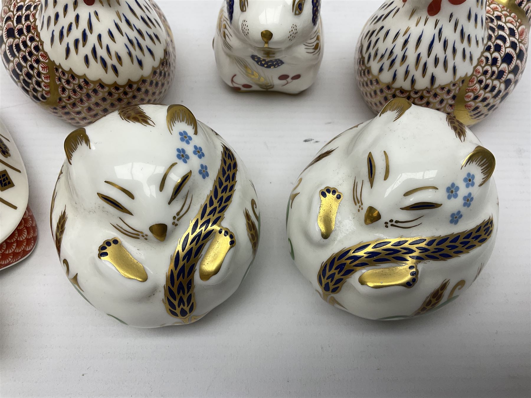 Seven Royal Crown Derby Paperweights, to include Field mouse with silver stopper, Dormouse, Chicken etc,  six without stoppers   