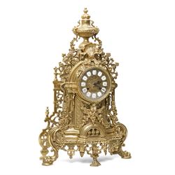 19th century design mantel clock, the brass dial with porcelain numerals, bell strike in brass case of rococo design with urn finial H60cm