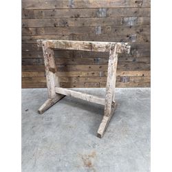 Pair of late 19th century pitch pine trestles, square tapering form in stripped finish