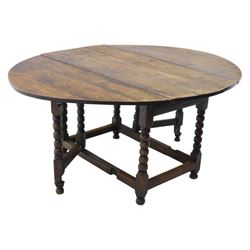 18th century country oak oval dining table, plank top with two drop leaves and gate-leg ac...