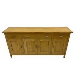 G-Plan - light oak sideboard, fitted with three drawers and four panelled cupboards