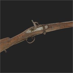 Middle Eastern percussion cap rifle, the 107cm  barrel with four brass bands and ramrod under, overall L143cm, together with another percussion rifle the 106cm barrel a copy of a 17th century Spanish barrel, complete with fake stamp, by vendors repute this rifle was confiscated from tribesmen in Kurdistan by police
Sold as an exempt item under Section 58 (2) of the 1968 Firearms Act, to be held as a curiosity or ornament
