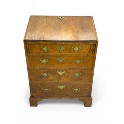 George III figured walnut bureau, fall-front enclosing central cupboard, six pigeonholes and six drawers, fitted with four graduated cockbeaded drawers, on bracket feet