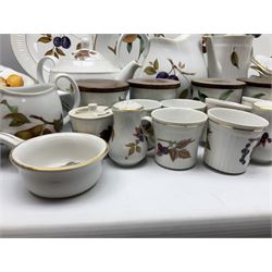 Royal Worcester Evesham pattern dinner and tea wares, to include lidded tureens, dinner plates, teacups, mugs, jugs, lidded canisters, sauce boat, oval serving dishes etc in three boxes