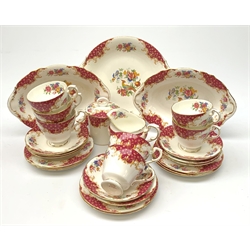 A Paragon Rockingham pattern tea set, comprising seven teacups and eight saucers, eight side plates, sucrier and cover, milk jug, sandwich plate, and two oval dishes. 