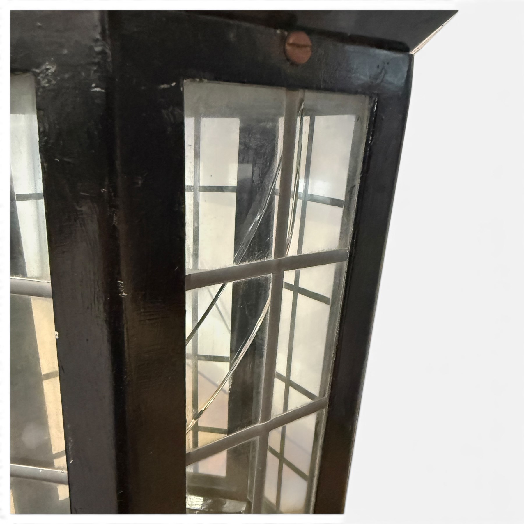 Georgian design black-painted metal octagonal hanging lantern, with brass ball finial above a hipped canopy, astragal glazed lattice panels and pendant ball terminal