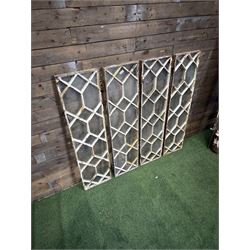 Four 19th century cast iron windows, lattice glazed in white painted finish, 