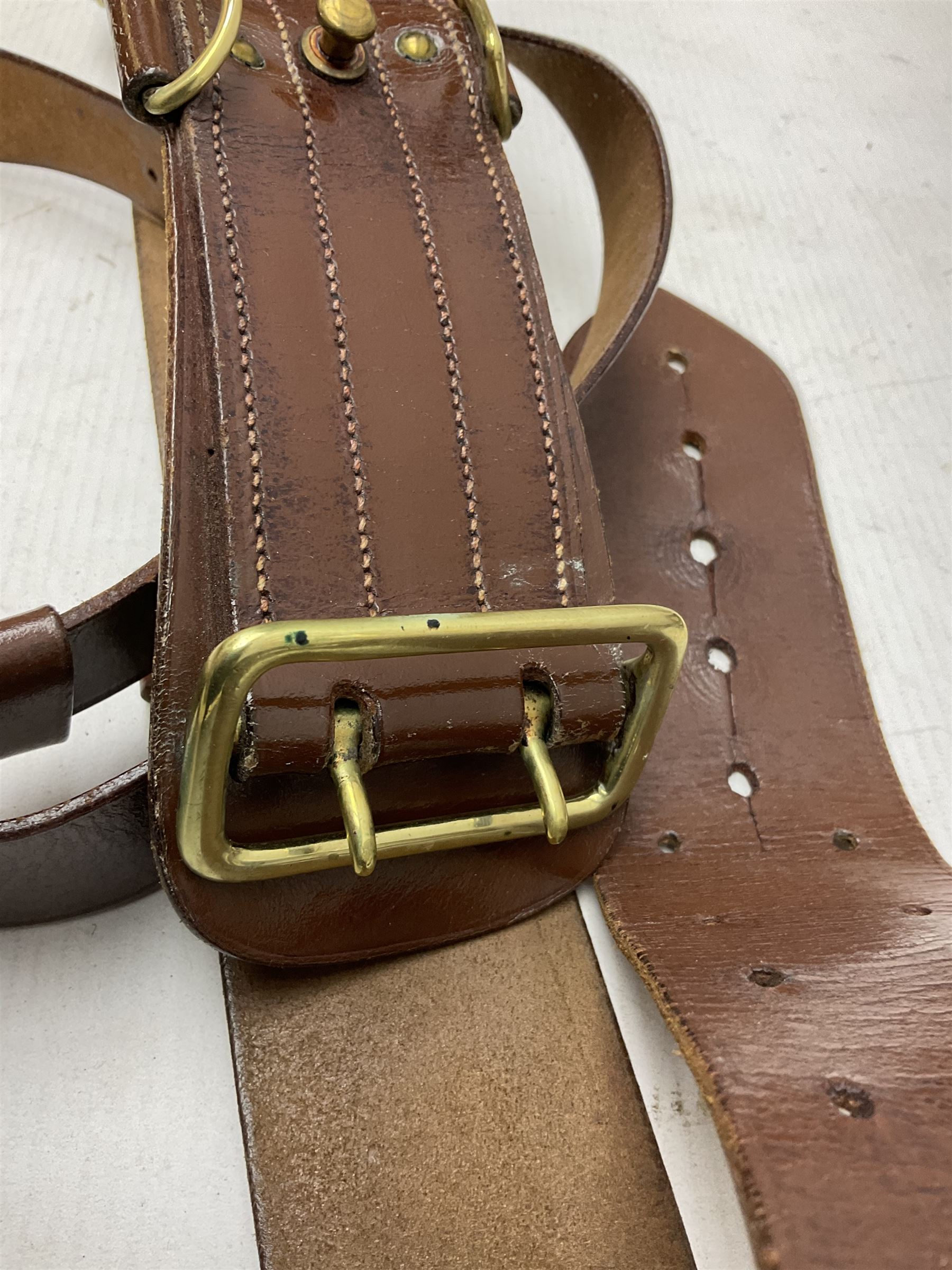 British Army General Staff officer's peaked cap by Herbert Johnson London in Moss Bros. delivery box; two officer's Sam Browne leather belts; leather pistol holster and sword hanger; pair of leather gloves and pair of spurs
