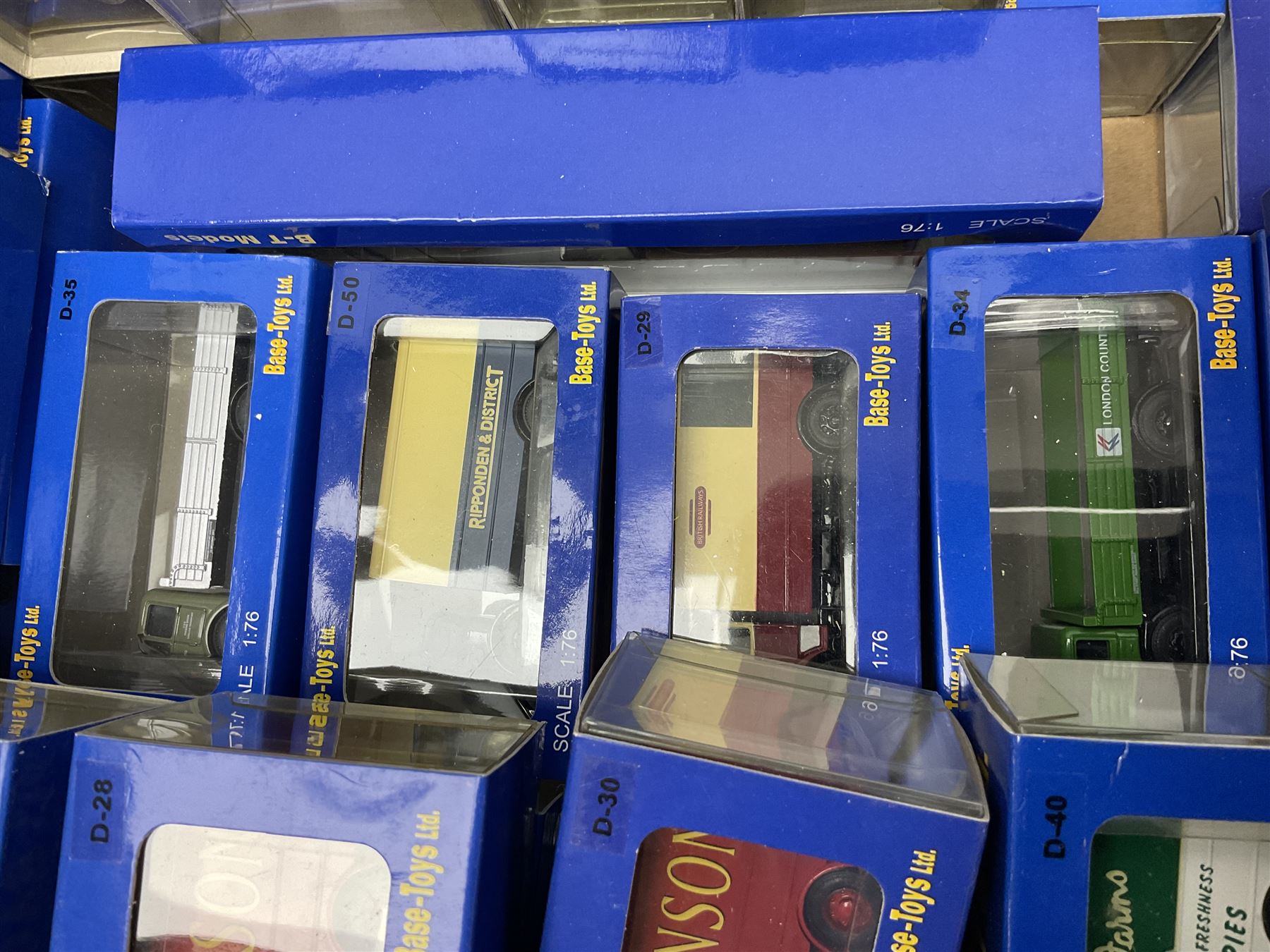 Fifty-seven Base Toys 1:76 scale die-cast models, all boxed (57)