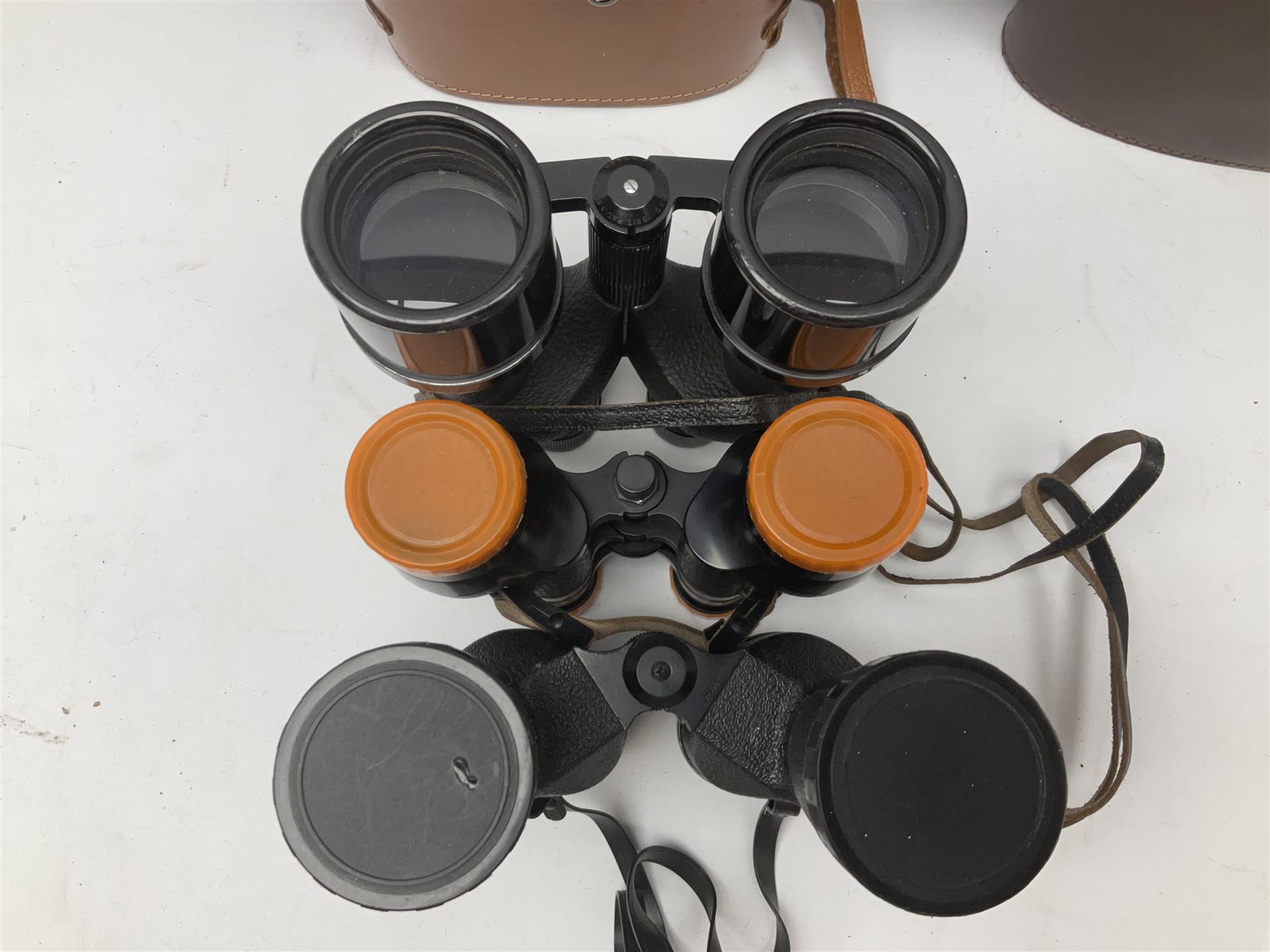 Ten cased pairs of binoculars, to include Ross London Steplux 7x50, Ross Solaross 16x60, Crescent zoom 7x- 12x50, Hilkinson 20x60,  Ross Stepnada 7x30,  Philo 10x50 etc