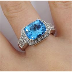 18ct white gold blue topaz and diamond cluster ring, with pave set diamond shoulders, hallmarked