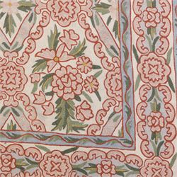 Kashmiri chain stitch crewel embroidered wall hanging, wool on cotton ground, decorated with an all-over lattice of floral medallions and stylized foliage with multiple floral borders 