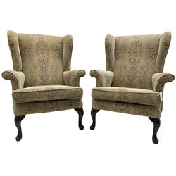 Parker Knoll - 'Burghley' pair of wingback armchairs, upholstered in 'Baslow Medallion' gold floral pattern fabric