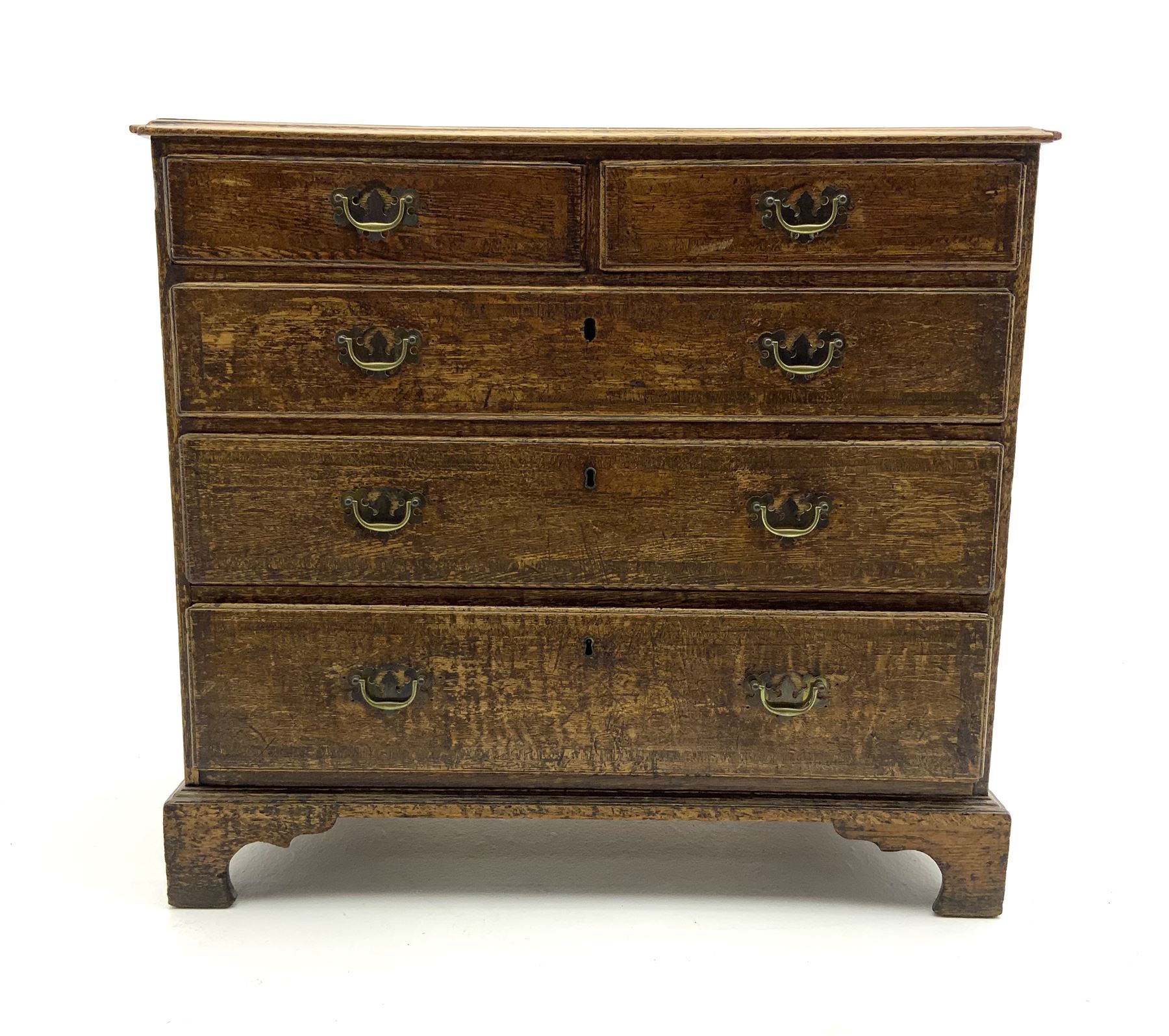 George III oak chest fitted with two short and three long drawers, corassbanded top
