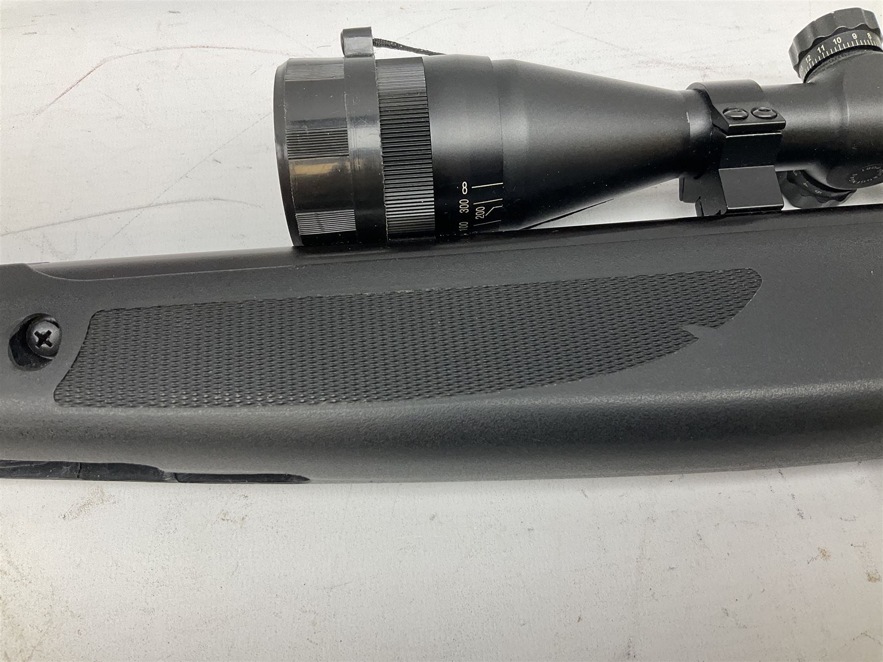 Stoegar .177 air rifle with break barrel action, 3 x 9 telescopic sight and fully integrated sound moderated barrel, no visible serial number, L109cm; in Stoeger lined gun sling