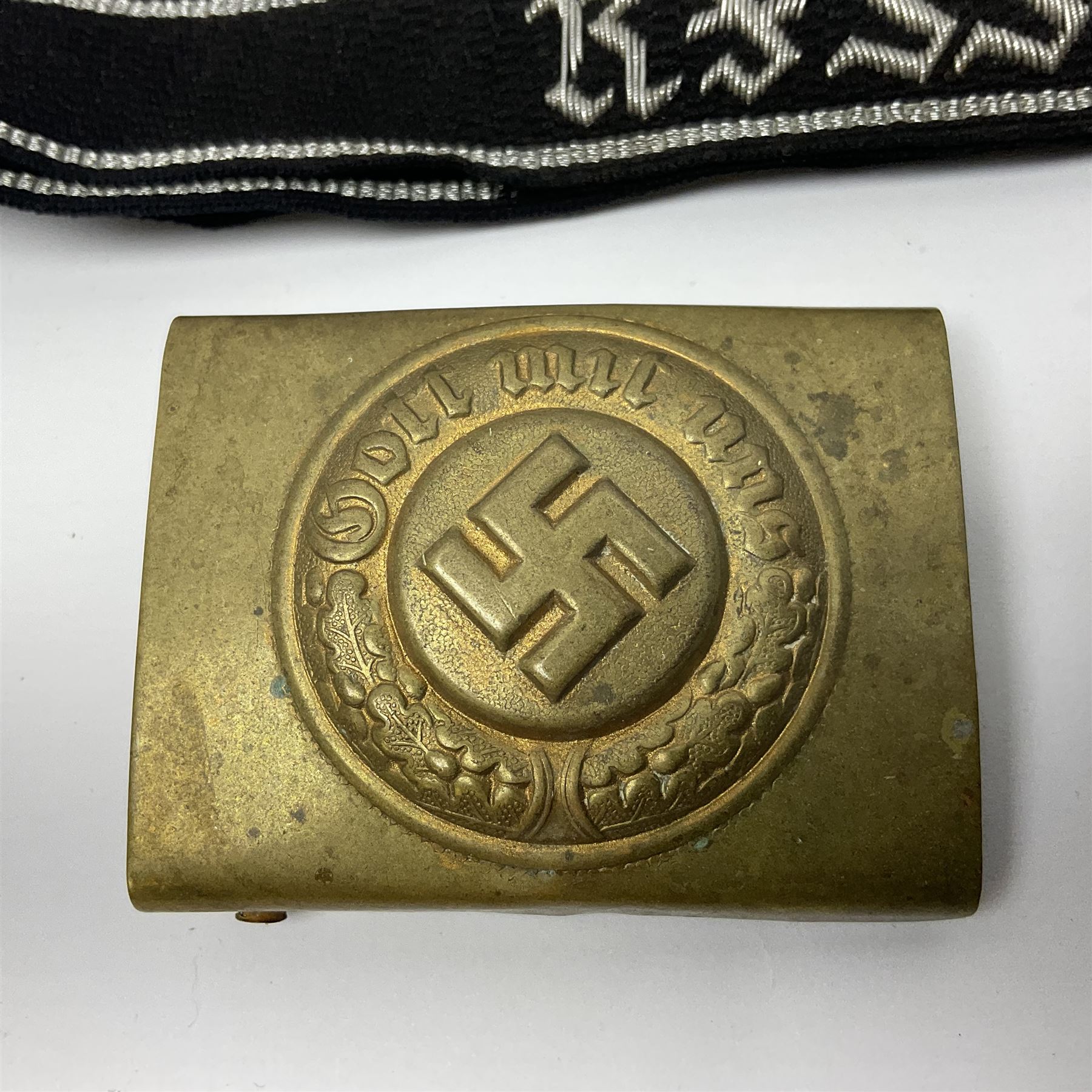 Three Reichsfuhrer 'SS' cuff titles; RZM 'SS' paper tag; German Water Police belt buckle; Destroyers badge marked RKS verso; N.S.B.O. lapel badge; and incomplete party eagle cap badge (8)