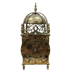 English - 20th century 8-day lantern clock in period 18th century style, square brass case surmounted by a domed bell, with a brass chapter, engraved dial centre and stylised period steel hands, with a two train spring driven movement striking the hours and half hours on a bell. With pendulum. 