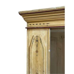 19th century painted pine wardrobe, the projecting cornice over mirror glazed door, with painted decoration depicting scrolling foliate and urns, drawer to base on skirt