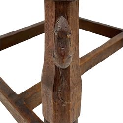 Mouseman - circa. 1930s set of six (4+2) oak dining chairs, panelled back carved with the Bagshawe family crest, the moto 'Forma Flos Fama Flatus' over an arm grasping a bugle-horn with ribbon tie and Yorkshire rose motif, adzed frame, leather lattice strap seat, on octagonal supports united by stretchers, two carvers and four side chairs, each carved with mouse signature, by Robert Thompson of Kilburn 

Provenance: Owned since manufacture by the Bagshawe family, descendants of the Staithes Group Artist Joseph Richard Bagshawe RBA (1870-1909).