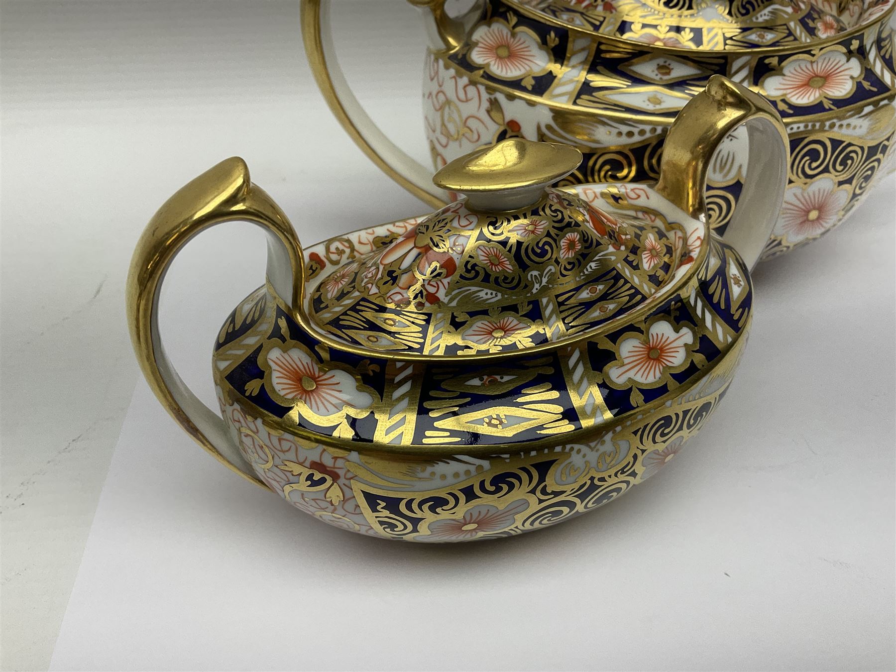 Royal Crown Derby 2451 Imari pattern three piece tea set, comprising teapot, covered sucrier and milk jug, teapot H12cm 