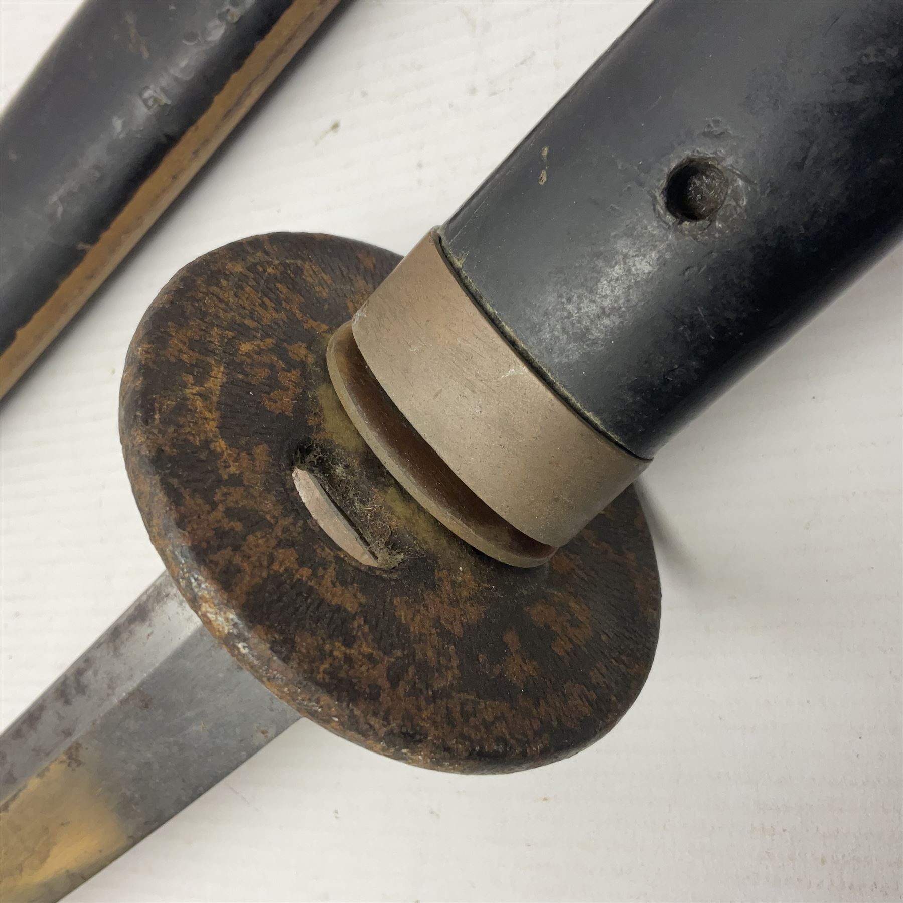 Good quality Japanese sword blade with later WWII fittings and scabbard  - 67.5cm slightly curving blade with unmarked tang, plain iron tsuba and lacquered grip with copper mounts; in lacquered wooden scabbard with tape bound tip L94cm overall