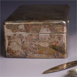 Group of silver, comprising silver mounted cigarette box, five decanter labels, page turner, commemorative teaspoon and a commemorative pin dish set with coin, all hallmarked