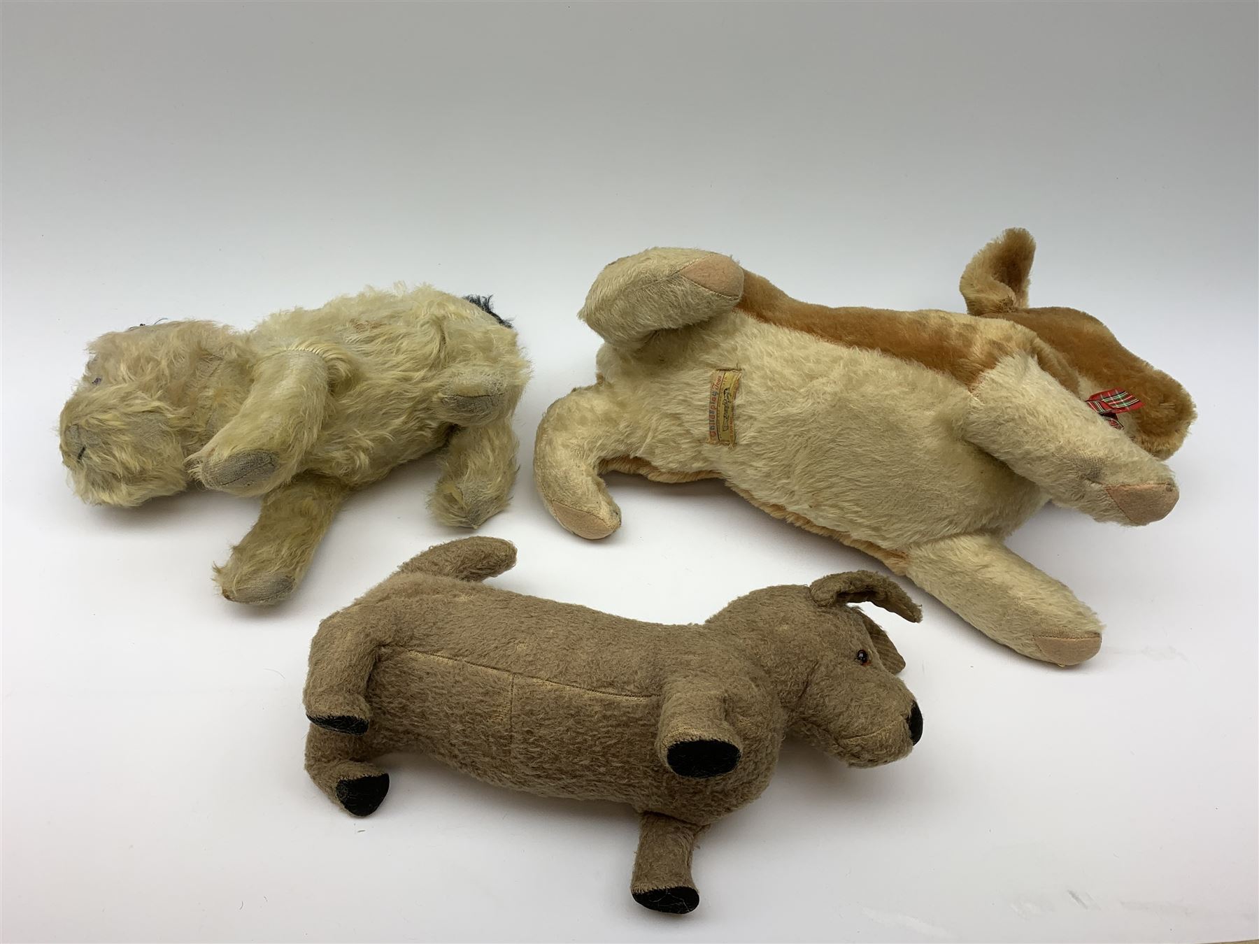 Three English dogs 1930s-60s including Deans Rag Book Co. Ltd. 'Childsplay' corgi in crouching position with two-tone body, glass type eyes and plastic nose with stitched mouth L18
