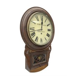 Richard Smith & Son, Scarborough - drop dial 8-day mahogany wall clock, with a turned wooden bezel, carved ear pieces and pendulum box with a glazed door and open carved fretwork,12