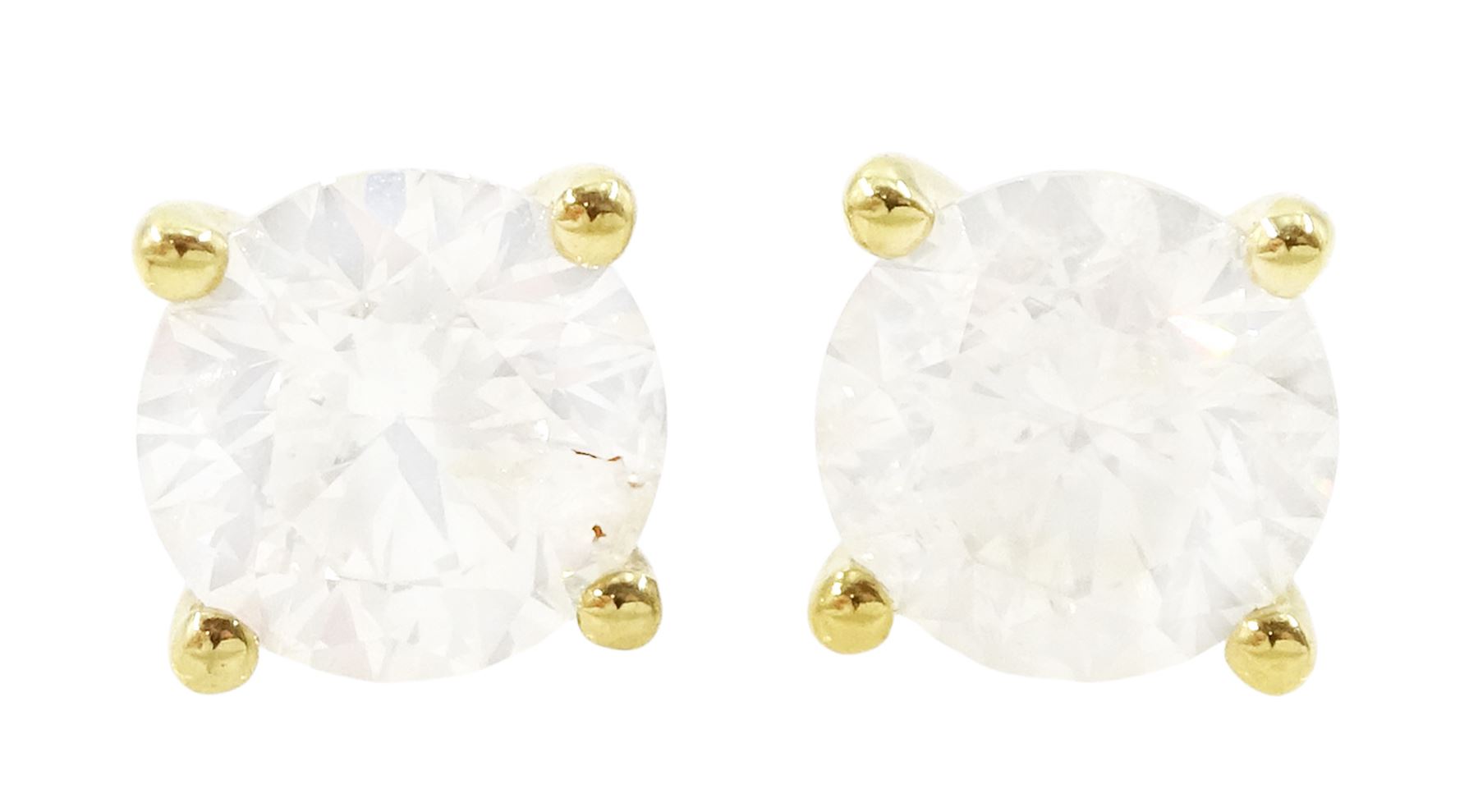 Pair of 18ct gold diamond earrings, each stud set with a single round brilliant cut diamond in a four claw setting, total diamond weight approx 2.15 carat
