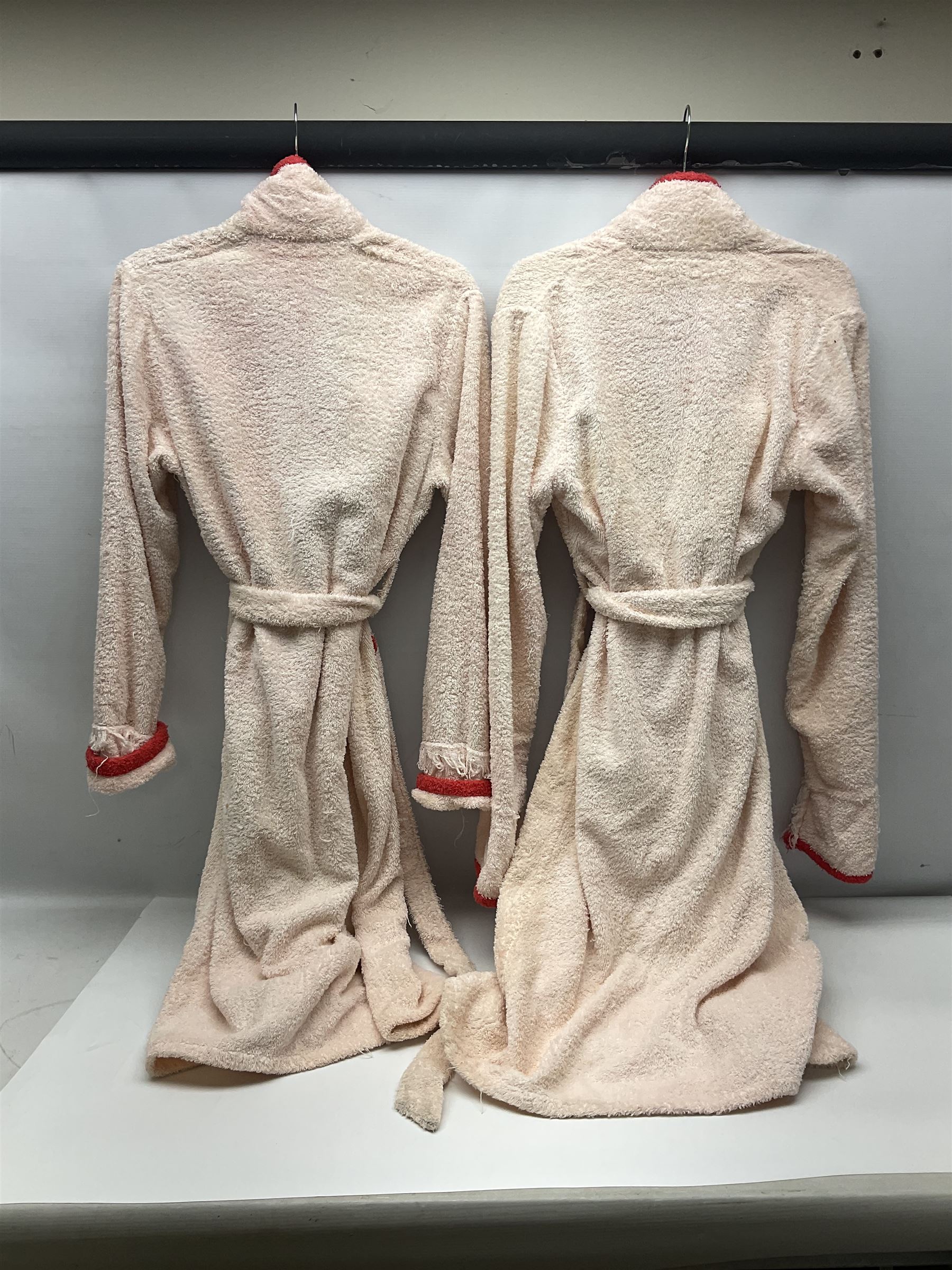 On the direct instructions of Anita Porter nee Lonsbrough Great British Olympic and Commonwealth Games gold medal winning swimmer - collection of early and international memorabilia comprising original Huddersfield Bath Club track suit top bearing eight stitched on cloth badges including British Empire & Commonwealth Games 1958 England Team, YSASA, North Eastern Counties ASA, ESSA Division 3,  English Schools Swimming Association winner etc
The swimming costume Anita wore at the 1958 Commonwealth Games in Cardiff, her first major championships, where she won two gold medals. The grey elastic on the sides, in those days, she would use to make it tighter and more streamlined.
Blue track suit from the 1960 Olympics which she wore on the podium receiving the gold medal.
1960 pool side towelling robe used at the Rome Olympics (interesting to note her name is spelt wrong on the embroidered label).
1962 Commonwealth Games pool side towelling robe used in Perth Australia when winning three Gold medals. 
It was also this year she became BBC Sports Personality of the year, the first female to do so.
Her 'lucky' pool side towel which she took with her to every event she competed in and which can be seen round her neck in many official celebratory photographs. Copies of some of these photographs are included for identification.
In addition there are two souvenir programmes of an evening event to honour Anita at The Theatre Royal Huddersfield and she has kindly signed the front cover on one of these.