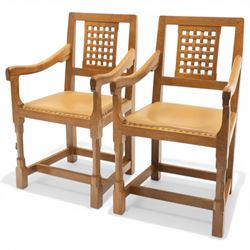 Rabbitman - pair of Yorkshire oak carver open armchairs, pierced and carved lattice back over tan leather seat with studwork, raised on octagonal supports united by H stretchers, carved with rabbit signature, by Peter Heap of Wetwang