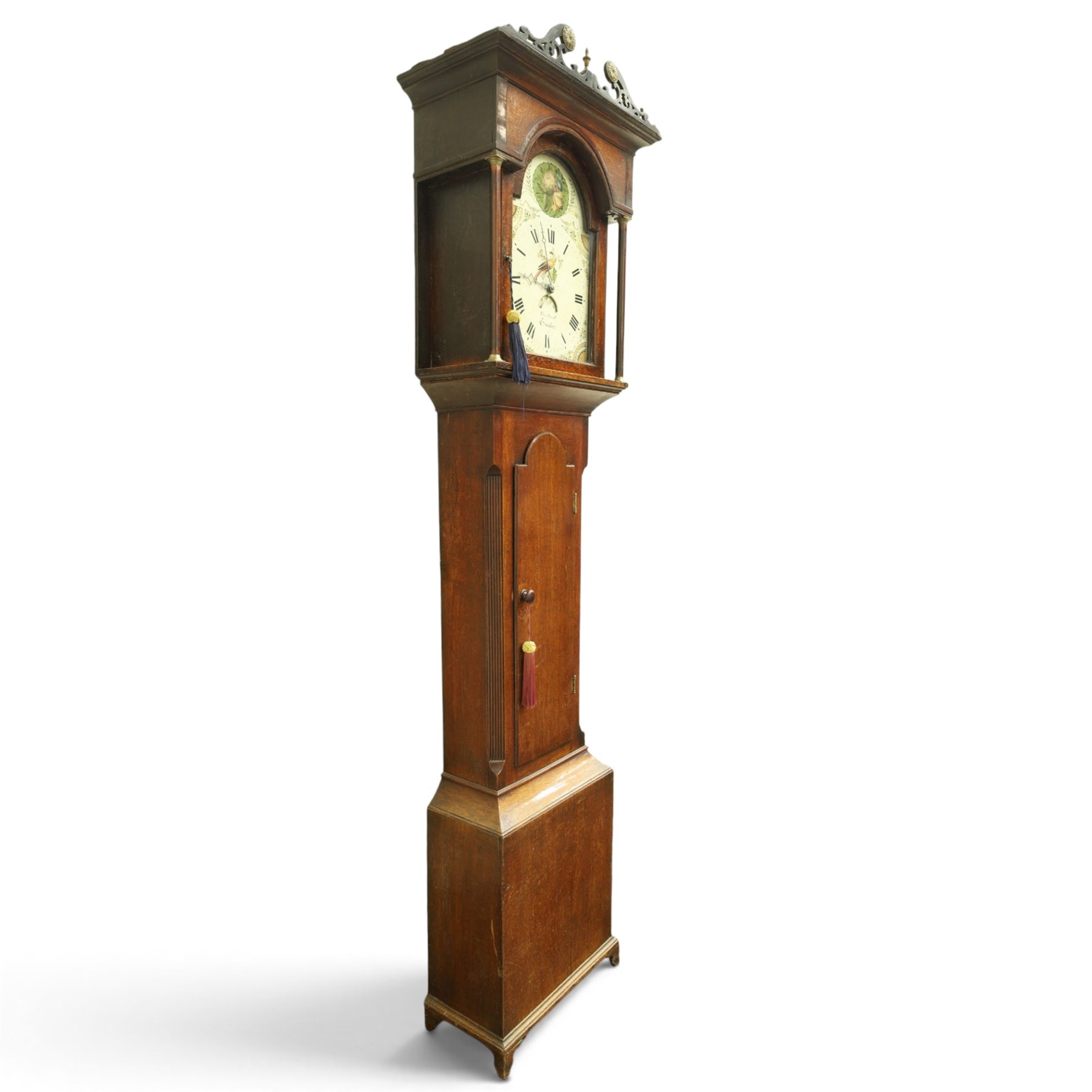 Thomas Small of Guisborough - George III oak eight-day longcase clock, the painted arched dial with calendar aperture, bird and floral decoration, the case with pierced fretwork broken swan-neck pediment and pilasters, reeded canted sides flanking arched trunk door