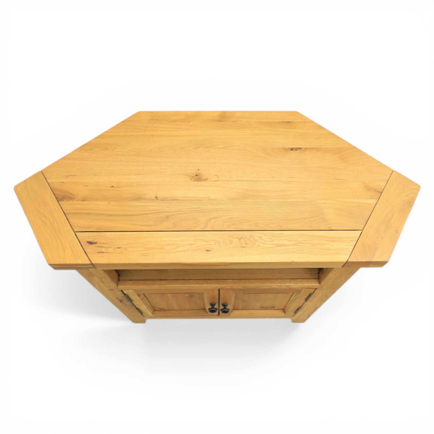 Modern light oak corner television stand, open recess above two cupboard doors with aperture to the back