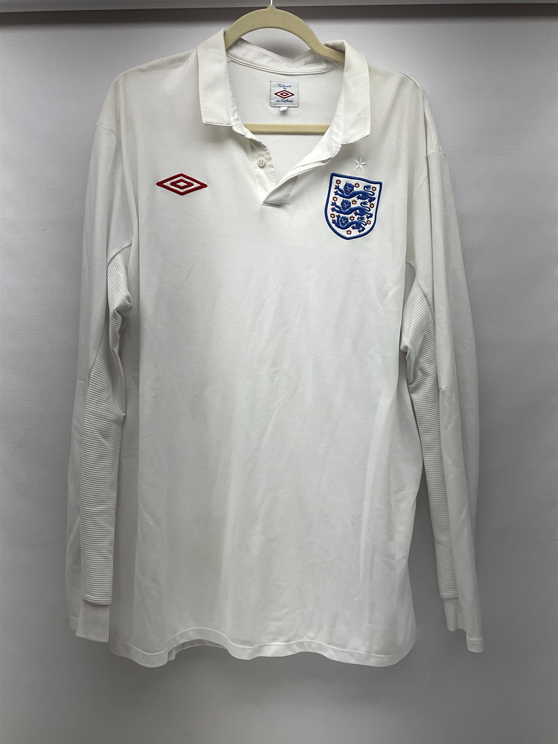 Fourteen items of replica sporting clothing including Leeds United football club shirts, England jerseys etc