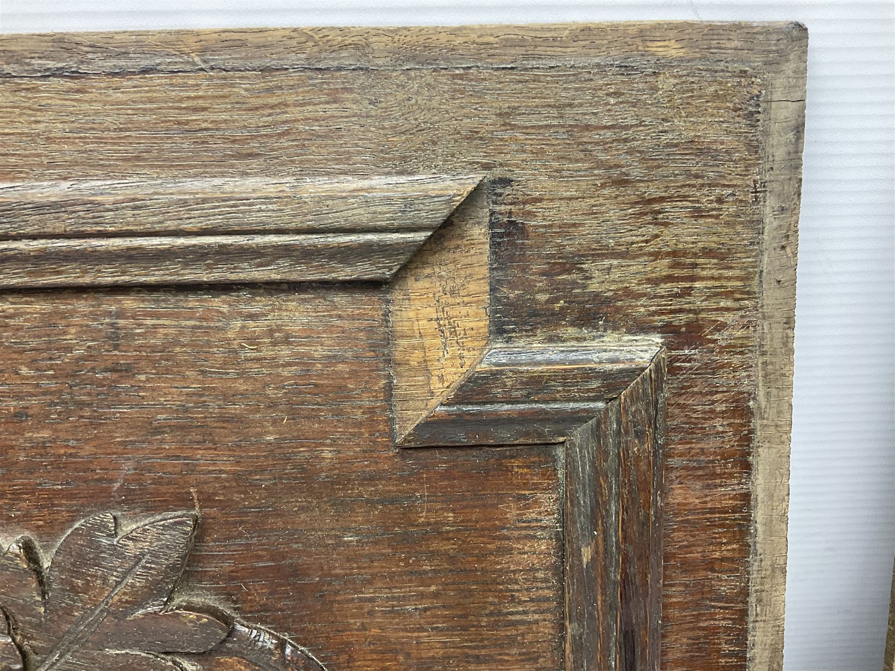 Pair of oak furniture door panels, carved in relief with a fox to one and a hound to the other, together with a pair of smaller oak panels, carved in relief with a hare to one and a grouse to the other, doors W63.cm x H62cm, panels W43cm x H60cm