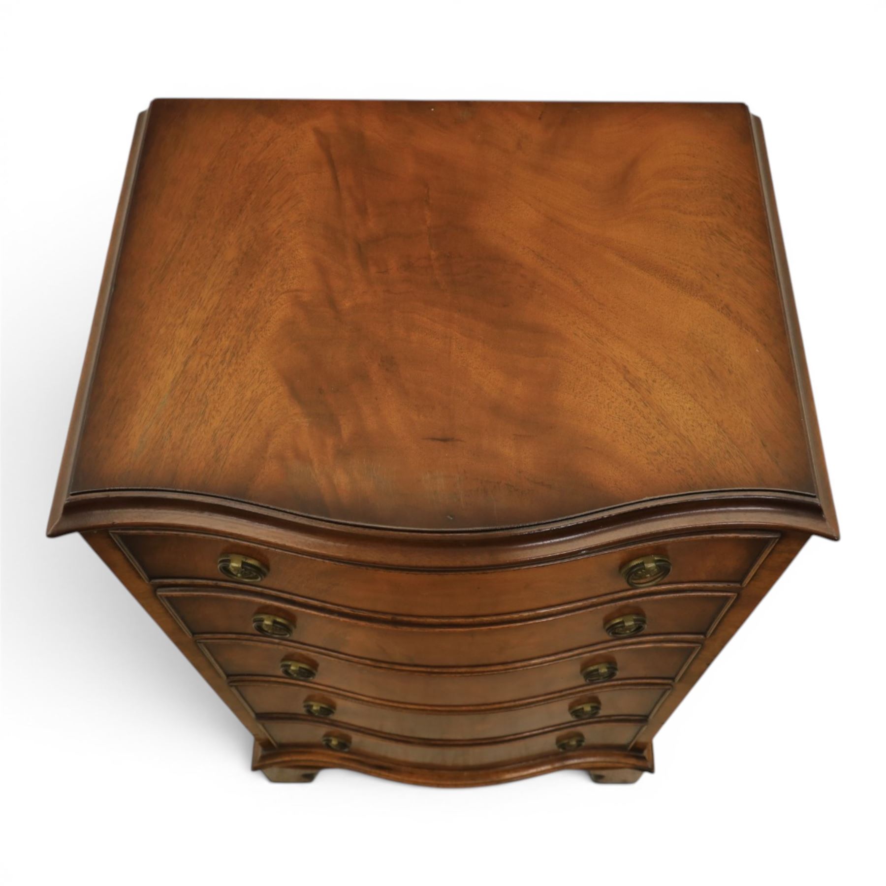 Reprodux - 20th century mahogany narrow serpentine chest, with six graduating drawers, later fitted with dividers, raised on bracket feet