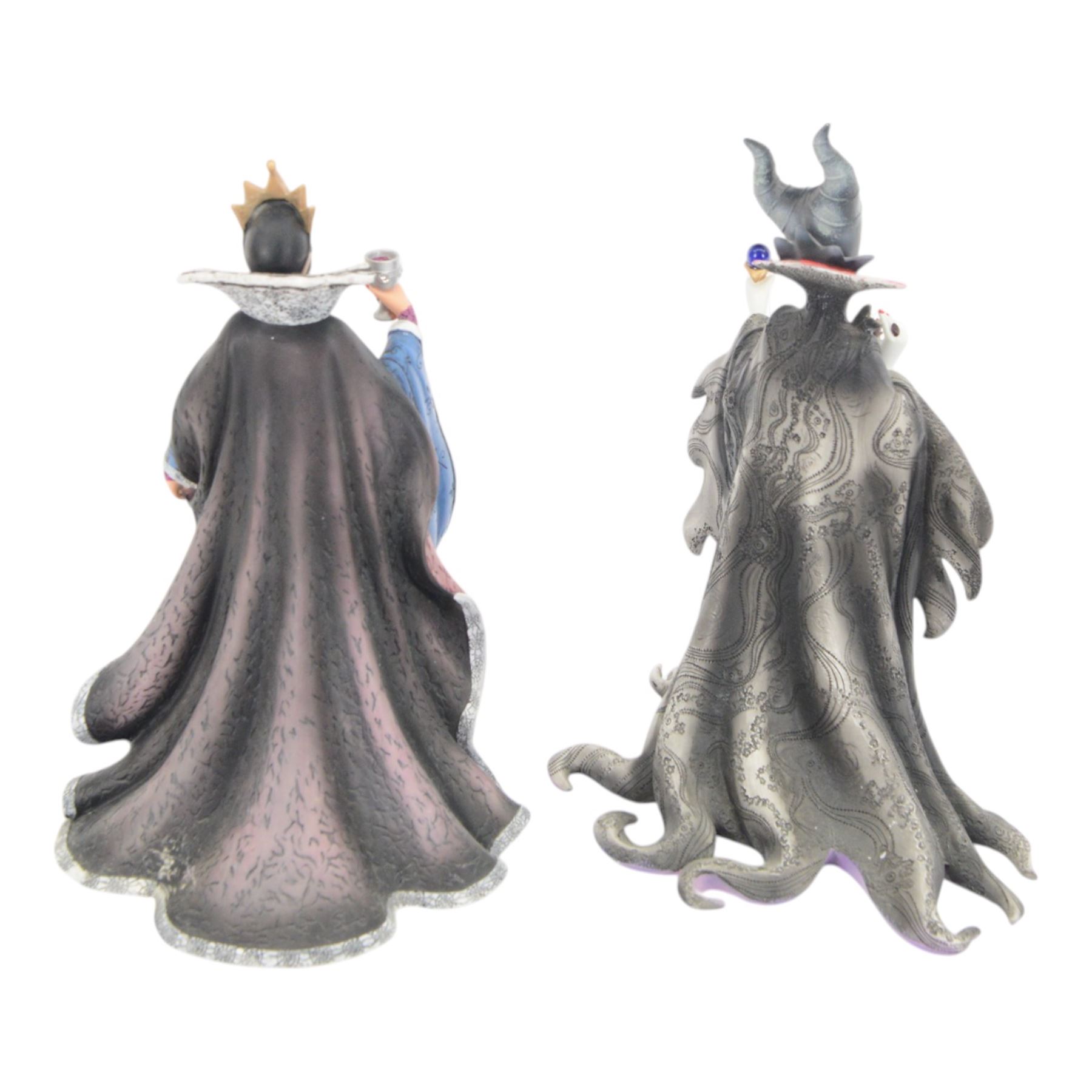 Disney Showcase Haute Couture figures, comprising Evil Queen, Cruella Devil and two Malificent, all boxed