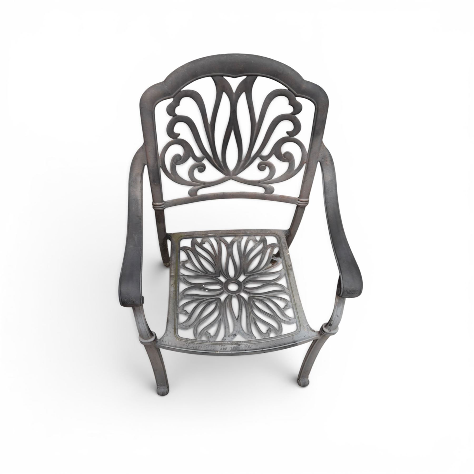 Circular aluminium garden table and pair of armchairs chairs with a pierced and scrolling backs 