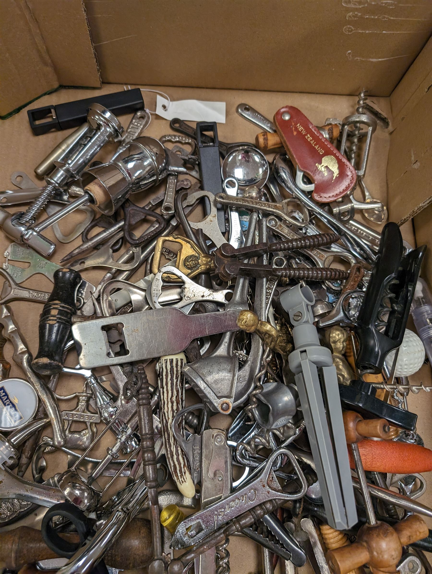 Collection of cork screws, bottle openers and bottle pourers, including turned wooden examples