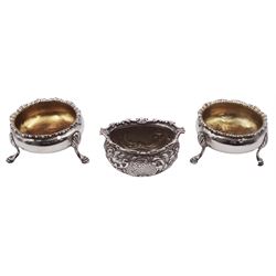 Pair of George III silver open salts, each of cauldron form with gadrooned rim, upon three hoof feet, hallmarked George Smith (II), London 1780, together with a Victorian open salt, of boat shaped form, embossed with foliate scrolls, hallmarked William Evans, London 1894, approximate weight 4.26 ozt (132.5 grams)