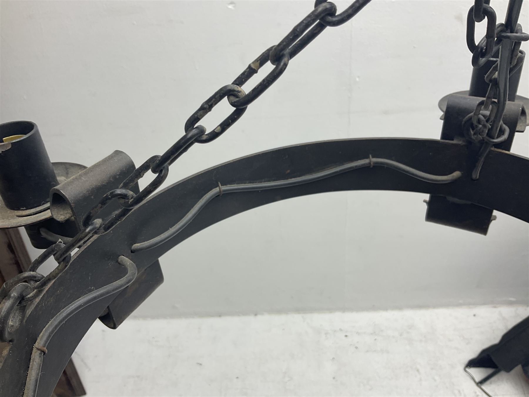 Pair of gothic style wrought iron ceiling lights, each with four branches, D58cm