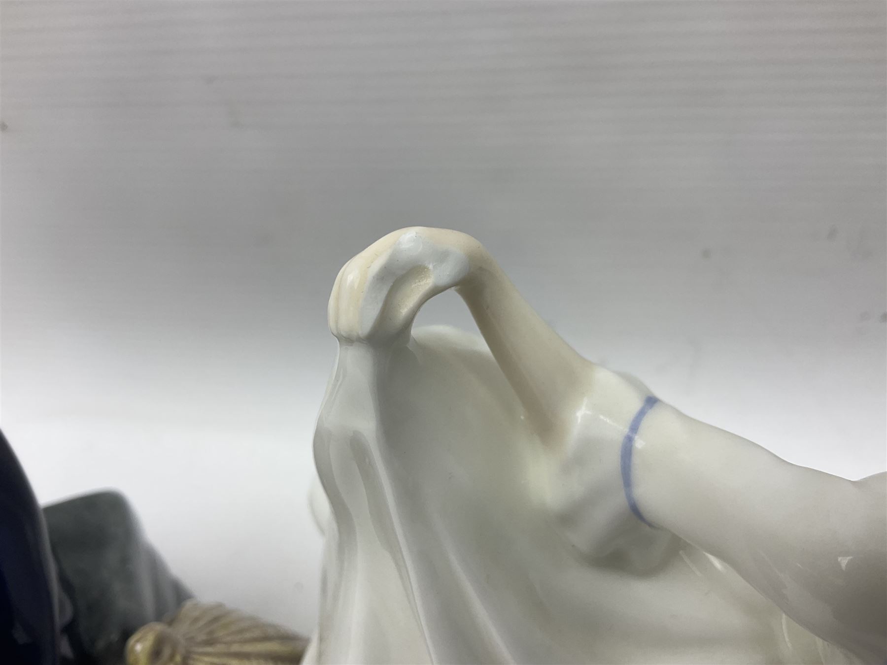 Five Royal Doulton figures, including Shore Leave HN2254, The Old Balloon Seller HN1315, Rose HN1348 etc, together with Royal Worcester Coquette