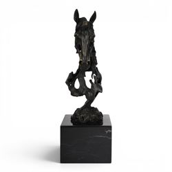 Stylised bronze model of an openwork horses head, signed Gadi and with foundry mark, raised upon black marble plinth, H41cm